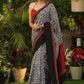 Spring bloom blue printed saree with Ajrakh and Cotton silk combination border with red stone Embellishment