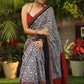 Spring bloom blue printed saree with Ajrakh and Cotton silk combination border with red stone Embellishment