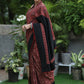 Sensuous maroon Ajrakh saree with black border & Accentuated with stone embellishment