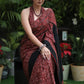 Sensuous maroon Ajrakh saree with black border & Accentuated with stone embellishment