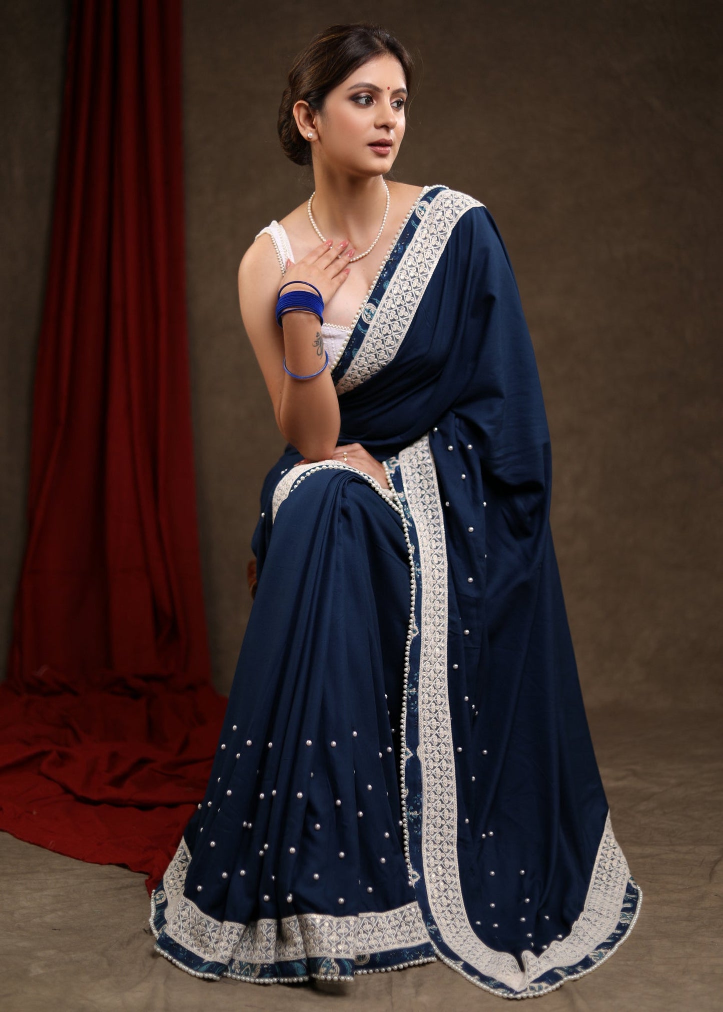 Elegant Ocean Blue Rayon Saree Highlighted with Moti Work & Beautiful Lace Detailing