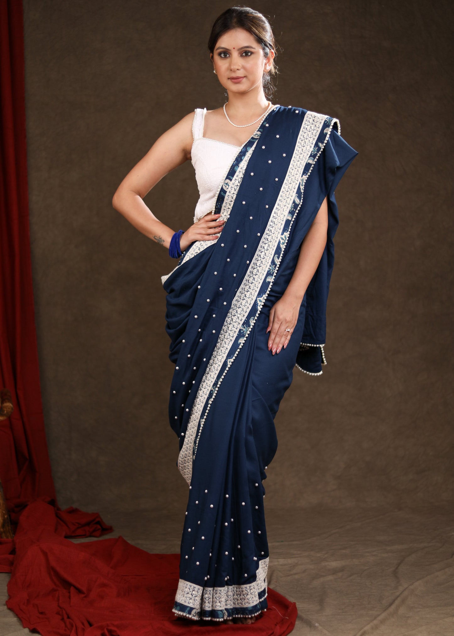 Elegant Ocean Blue Rayon Saree Highlighted with Moti Work & Beautiful Lace Detailing