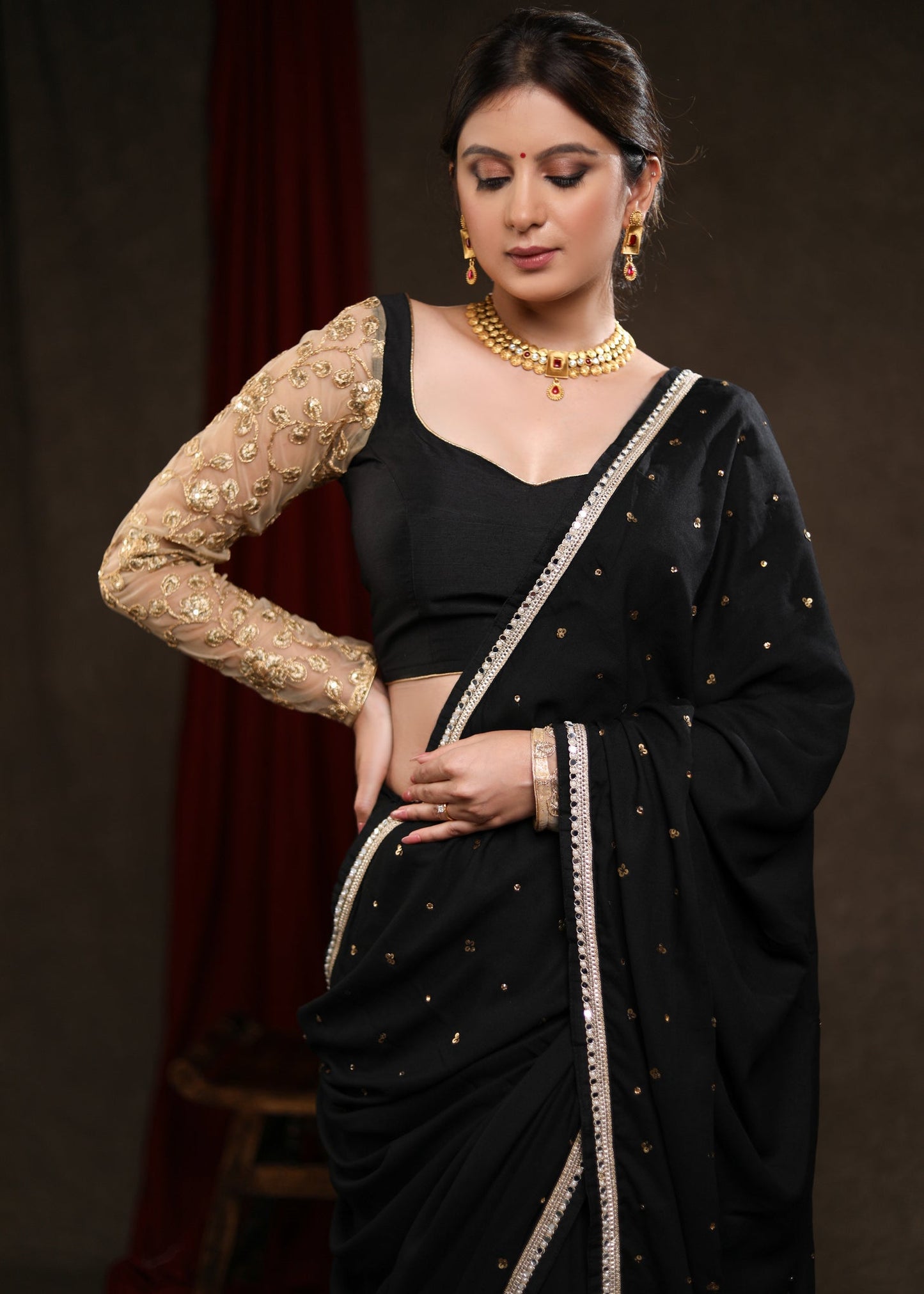 Classy Black Rayon Saree Adorned with Delicate Gold Hand Embroidery & Lace