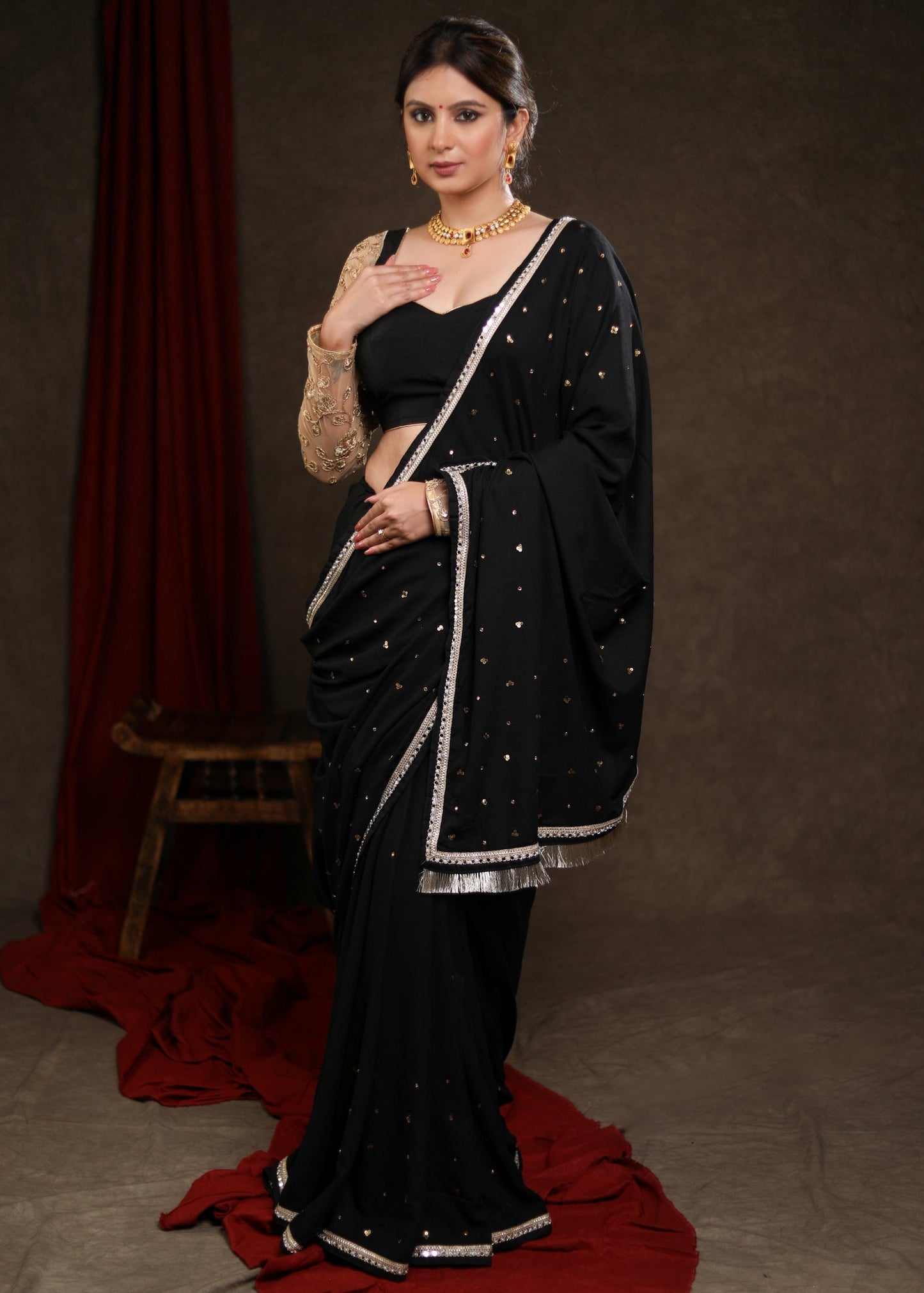 Classy Black Rayon Saree Adorned with Delicate Gold Hand Embroidery & Lace