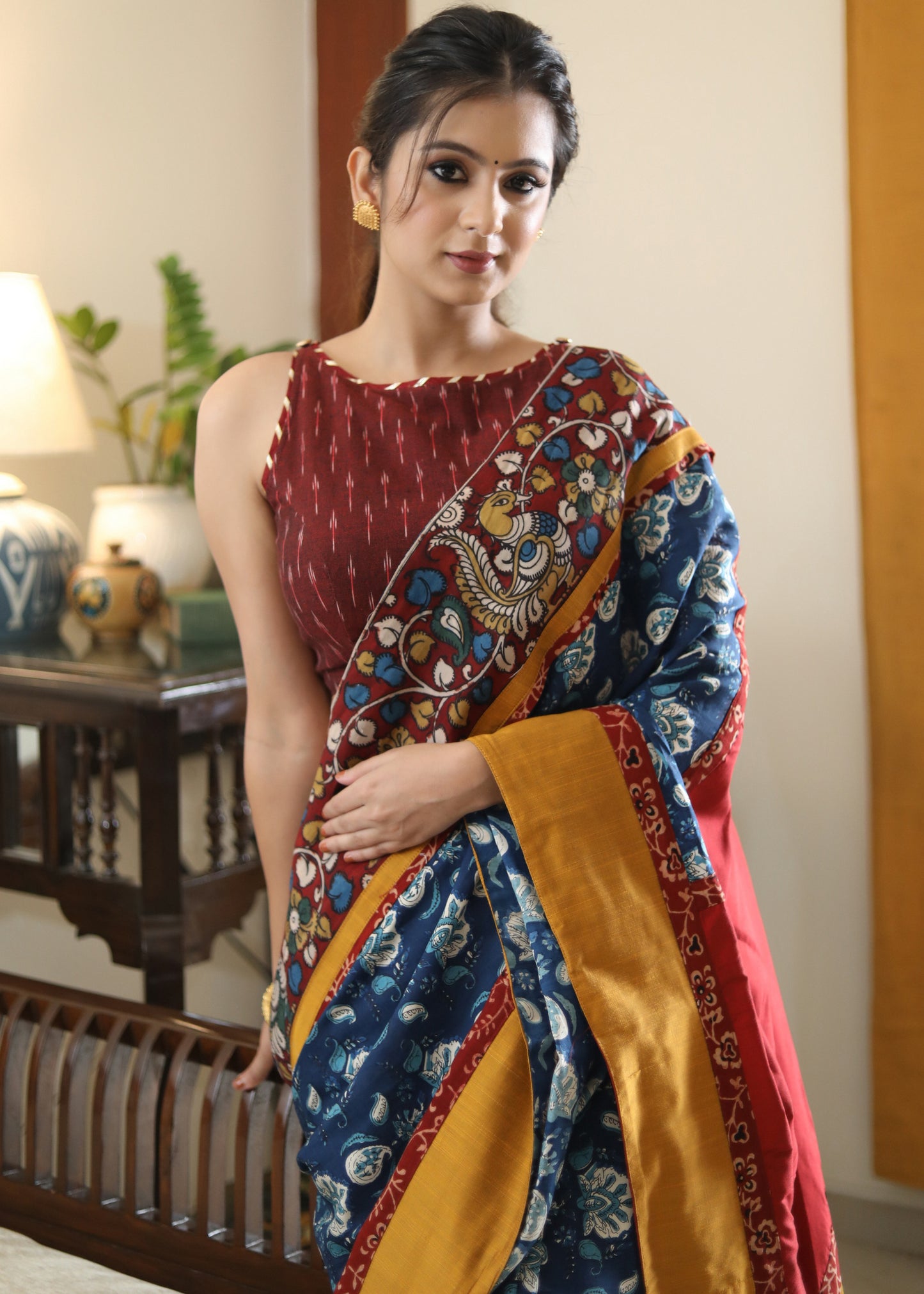 Lustrous blue printed saree graceful Madhubani painted Pallu with maroon and mustard border