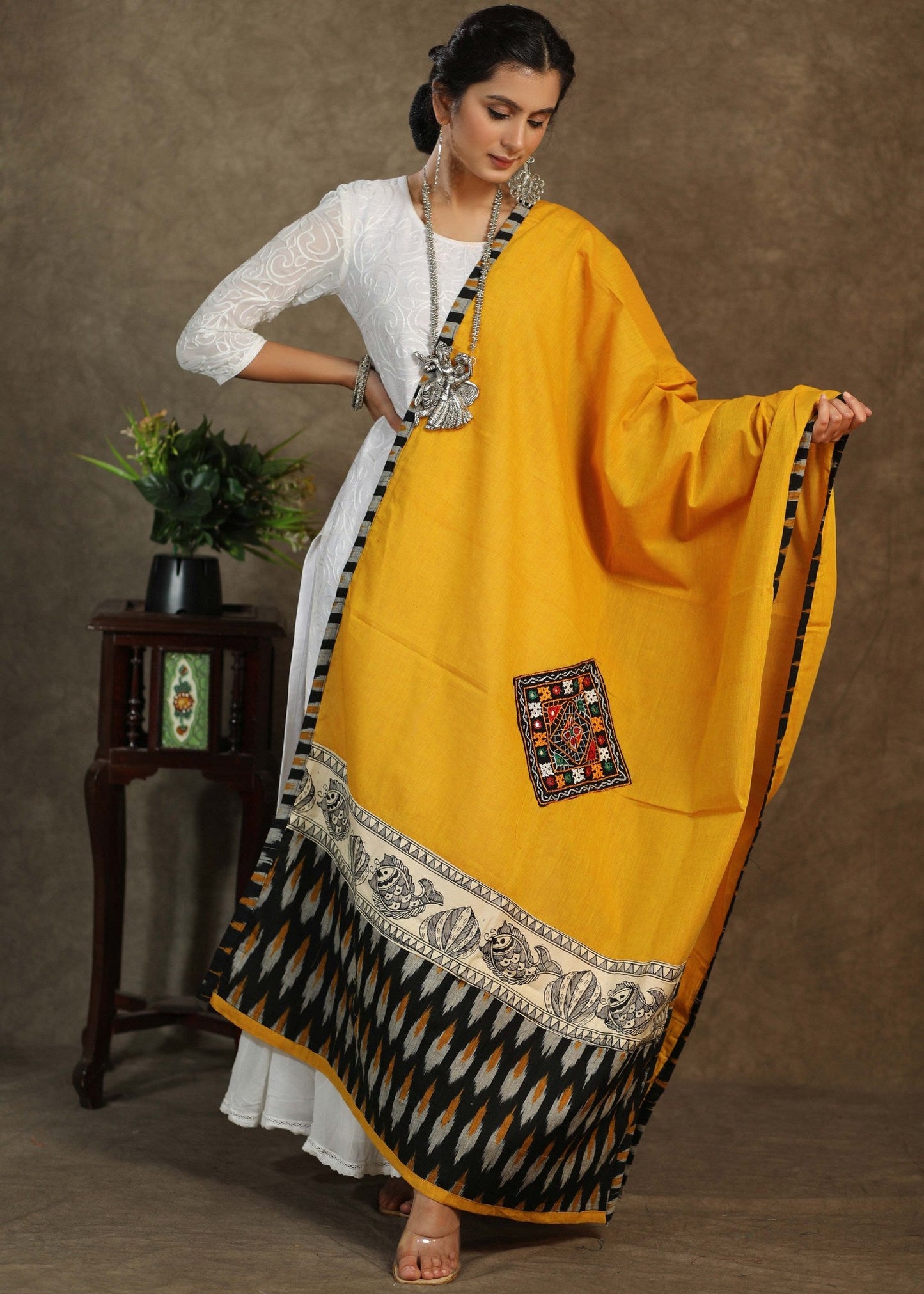 Elegant cotton mustard dupatta with exclusive hand painted Madhubani art and mirror work