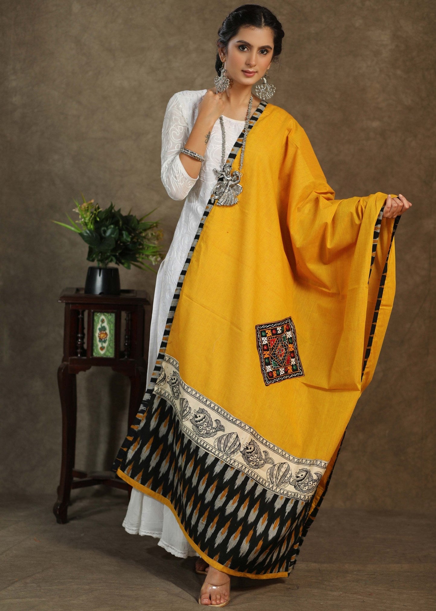 Elegant cotton mustard dupatta with exclusive hand painted Madhubani art and mirror work