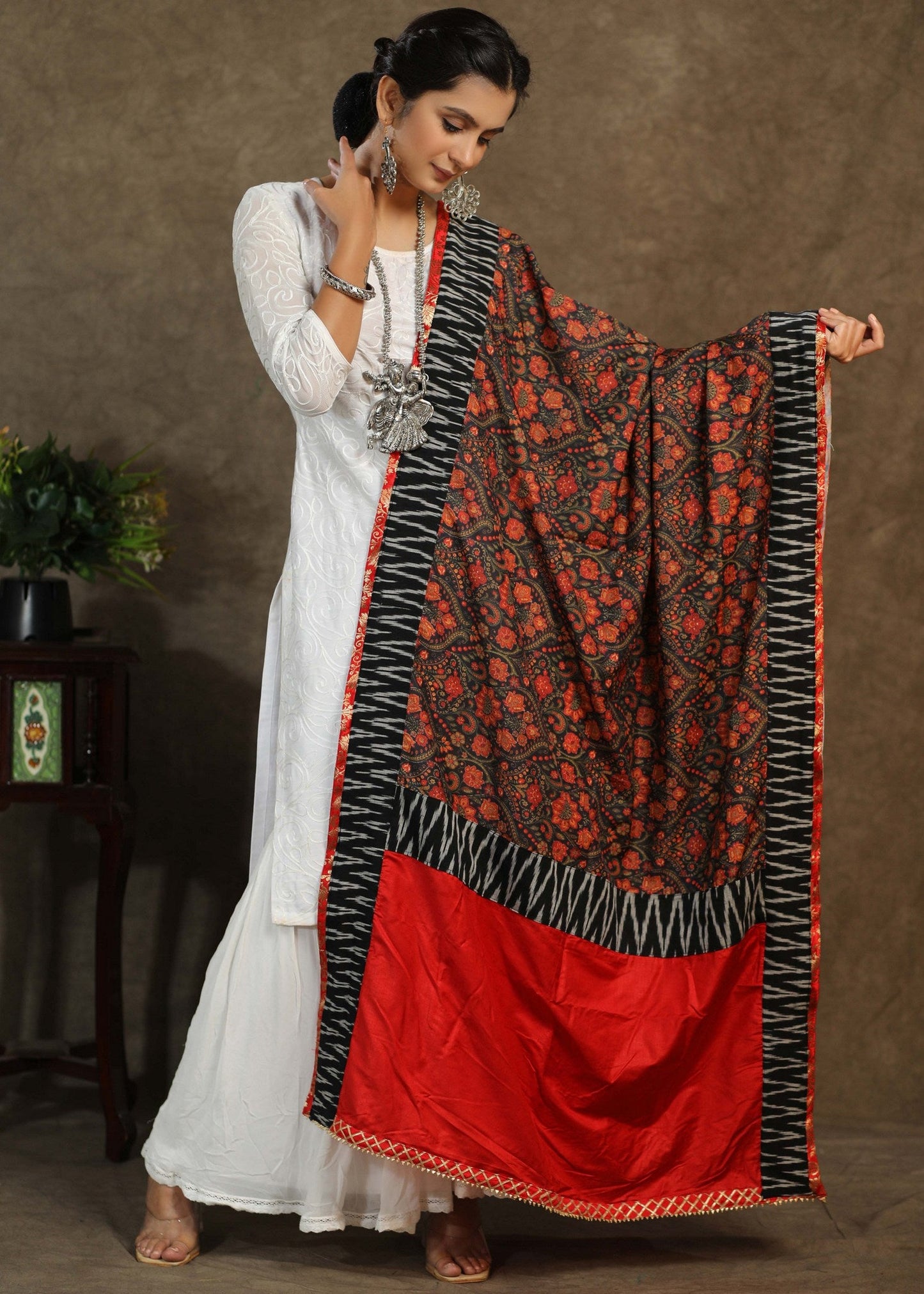 Red print dupatta with black Ikkat and gota-patti border