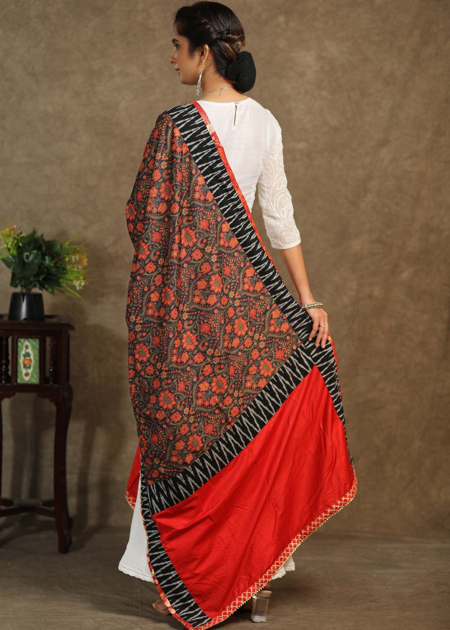 Red print dupatta with black Ikkat and gota-patti border