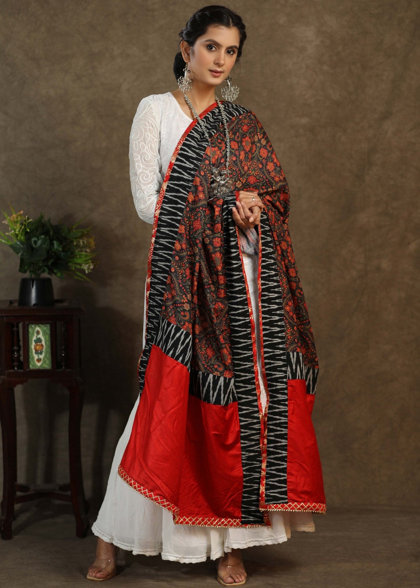 Red print dupatta with black Ikkat and gota-patti border