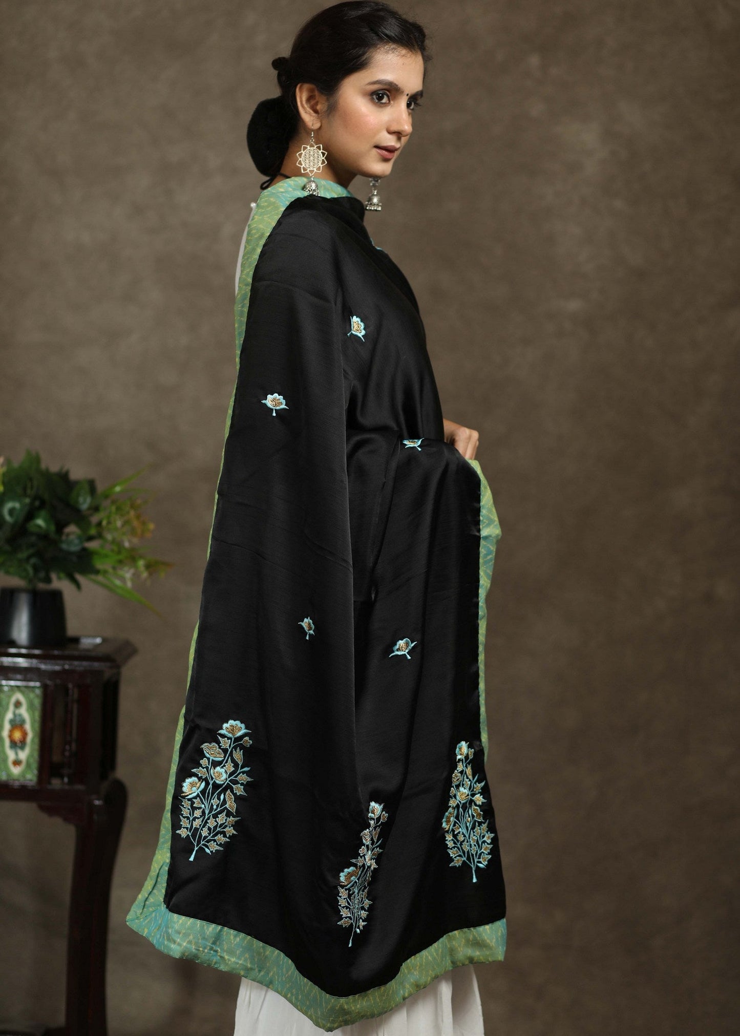 Beautiful black dupatta with elegant green embroidery and Ikkat border