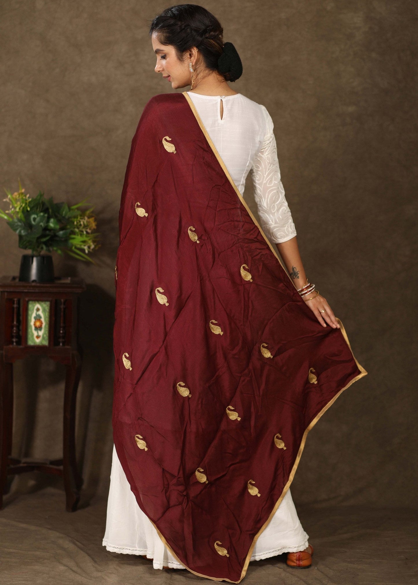 Maroon dupatta with delicate golden embroidery