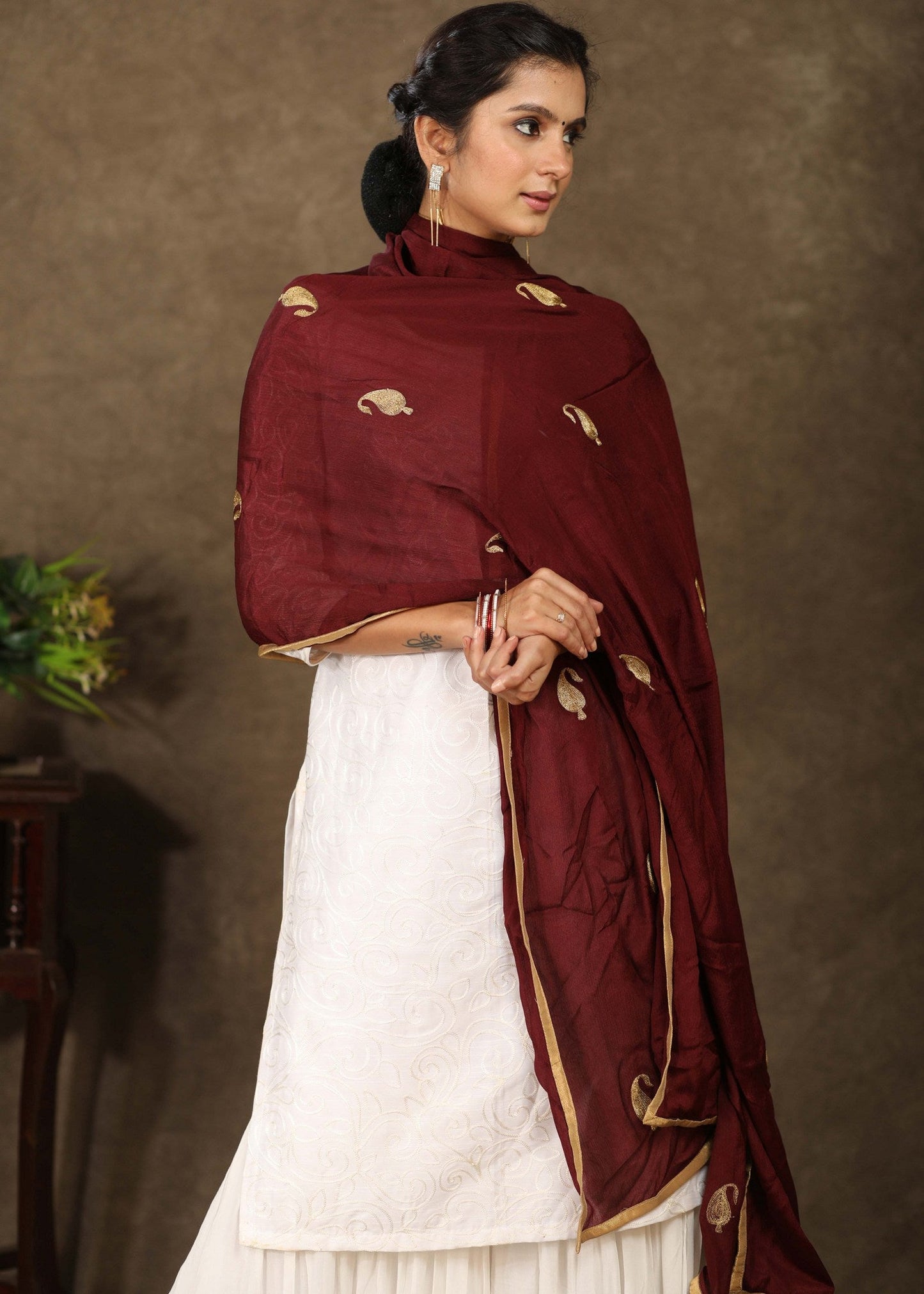 Maroon dupatta with delicate golden embroidery