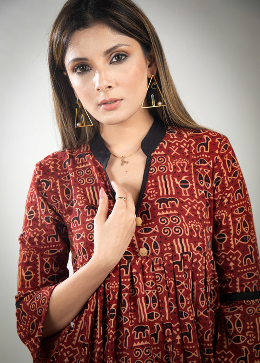 Rust colour printed Ajrakh dress with black detailing & pockets