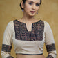 Smart Cream Blouse with Black Ajrakh yoke & Sleeves Highlighted with Black pom-pom Lace