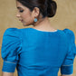 Striking Firozi Blue Puff Sleeves Elbow Length Blouse with Silver Detailing