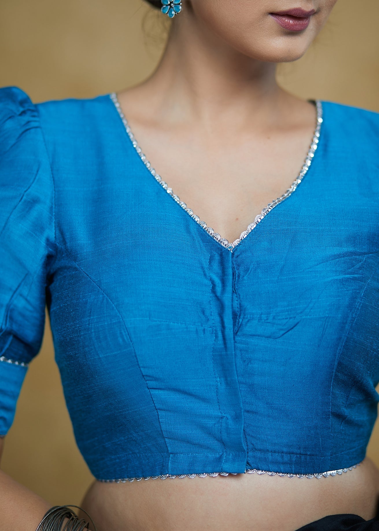 Striking Firozi Blue Puff Sleeves Elbow Length Blouse with Silver Detailing