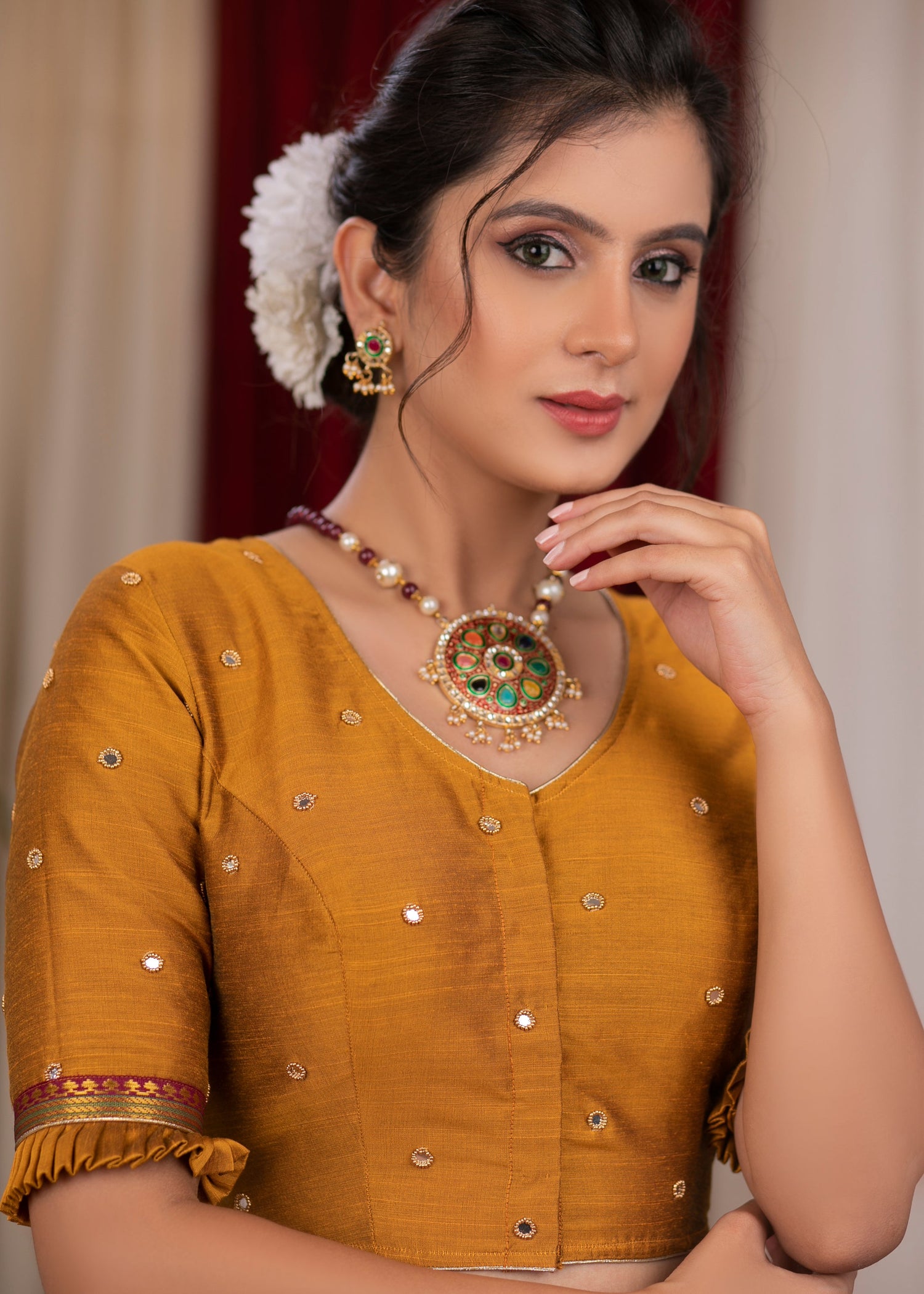 Exclusive metallic gold blouse with overall mirror embroidery highlighted with banarasi lace