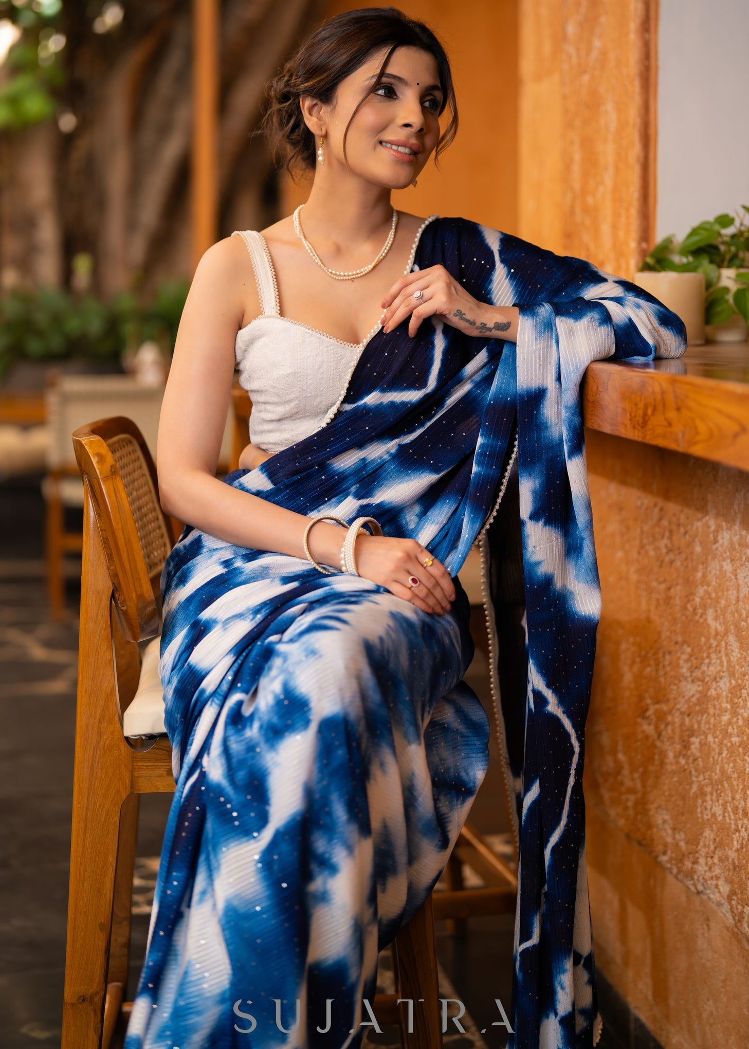 Stylish Navy Blue Shibori Georgette Saree With Beautiful Overall Sequenced Crochet Highlighted With Minimal Pearl Lace