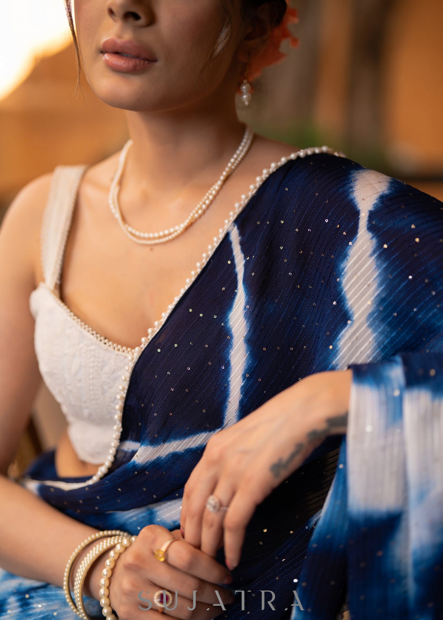 Stylish Navy Blue Shibori Georgette Saree With Beautiful Overall Sequenced Crochet Highlighted With Minimal Pearl Lace