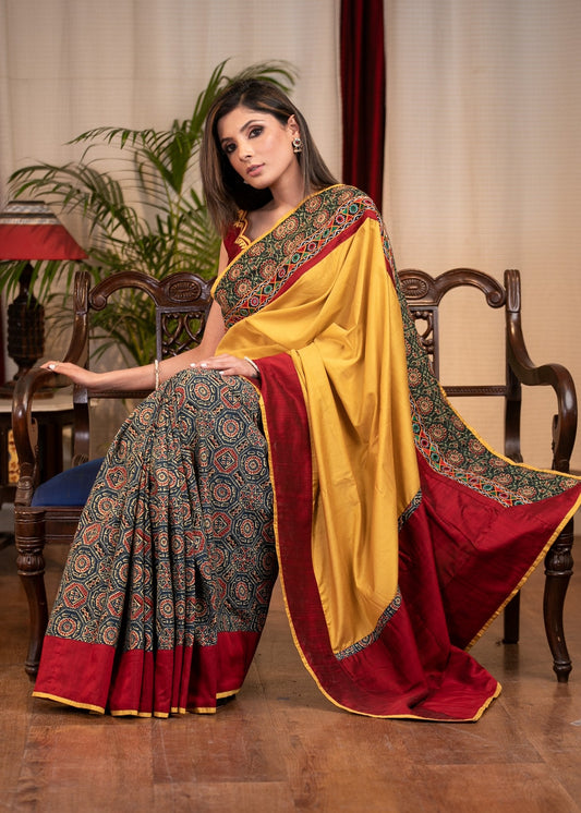 Mustard semi silk saree with printed Ajrakh pleats & mirror work border