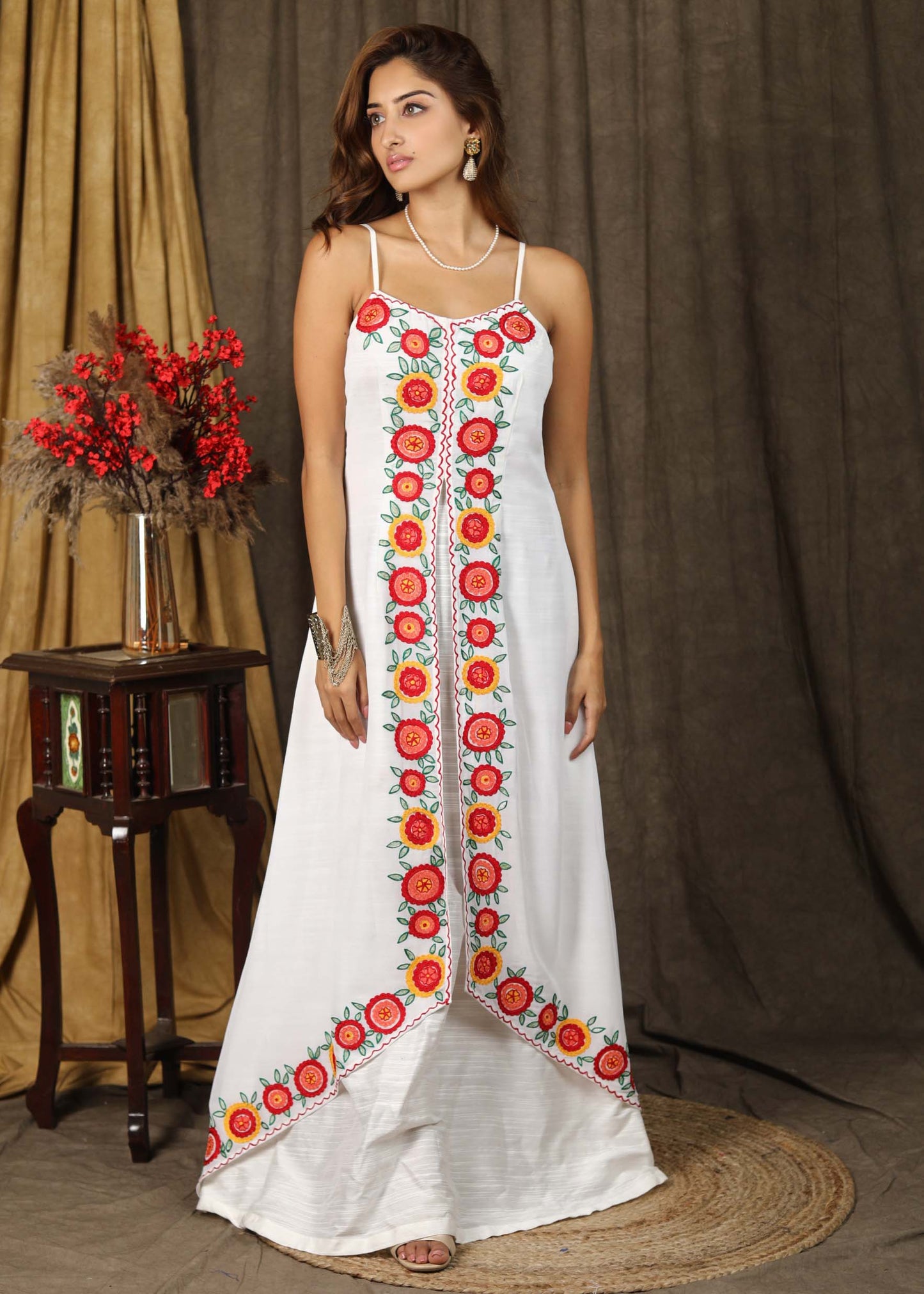 Classy white boho inspired strappy maxi dress with floral embroidery on front layer with optional georgette shrug