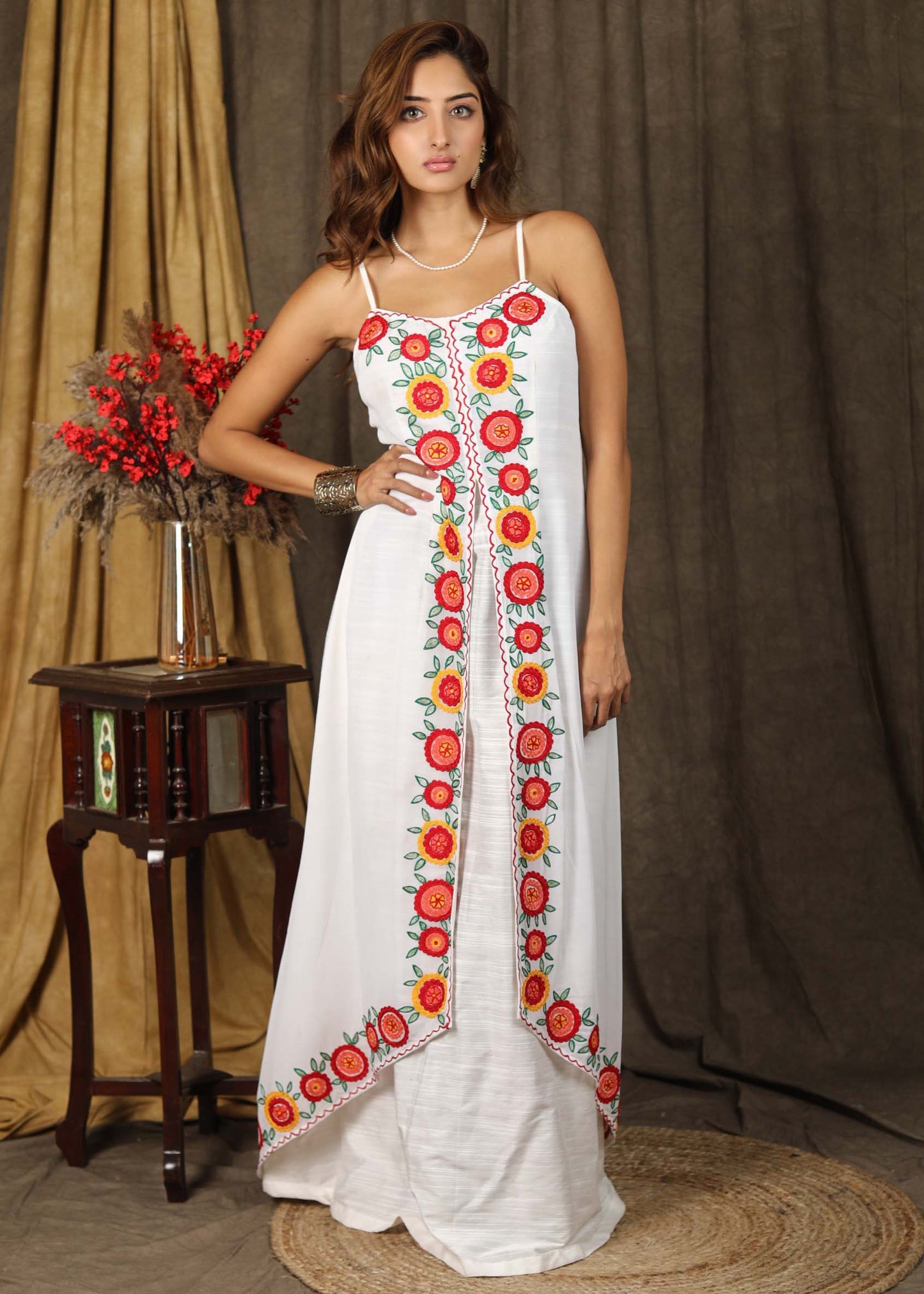 Classy white boho inspired strappy maxi dress with floral embroidery on front layer with optional georgette shrug