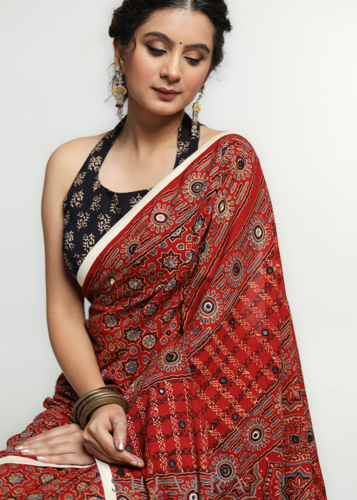 Stunning Red Ajrakh Saree with Mirrorwork detailing & White Border