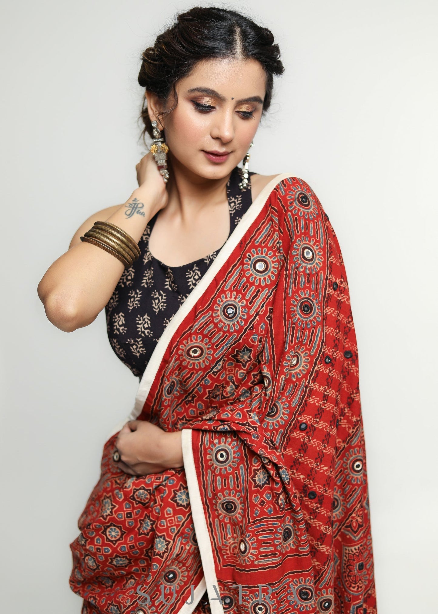 Stunning Red Ajrakh Saree with Mirrorwork detailing & White Border