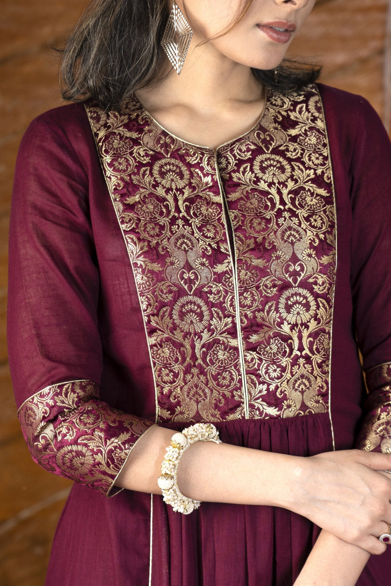 Exclusive wine colored cotton Kurta with brocade yoke & embroidered cotton pants - Dupatta optional.