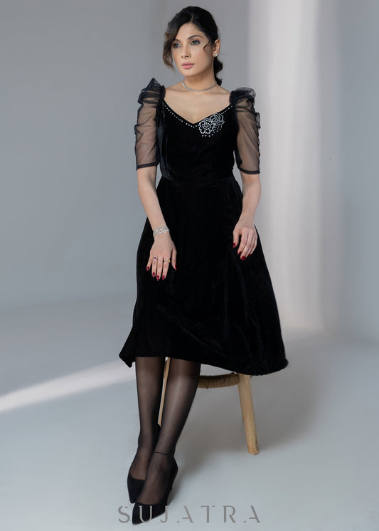 Exclusive black velvet dress with net sleeves & stone work on neckline