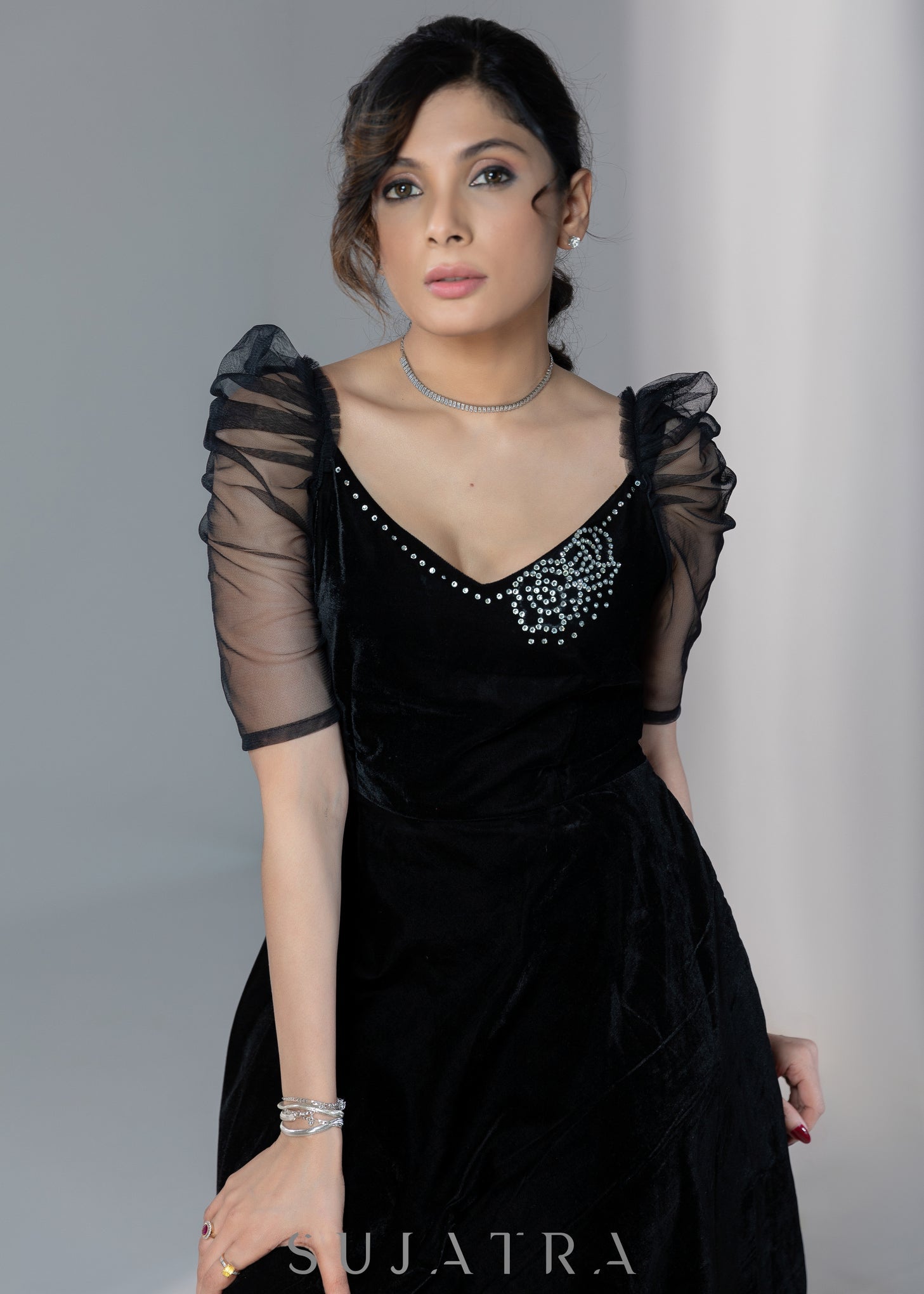 Exclusive black velvet dress with net sleeves & stone work on neckline