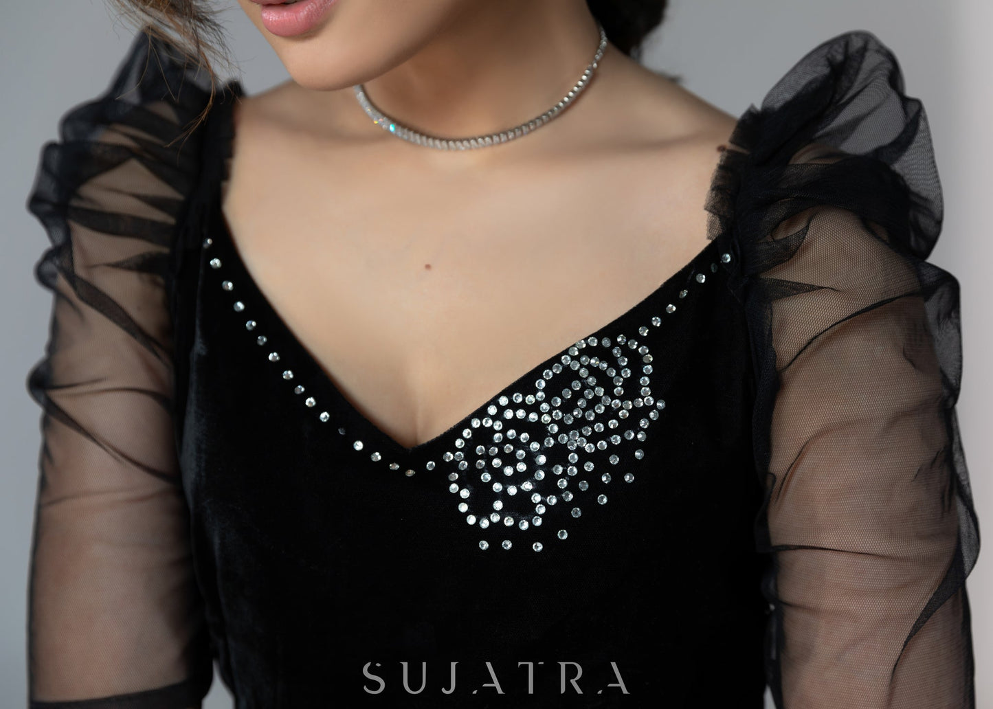 Exclusive black velvet dress with net sleeves & stone work on neckline